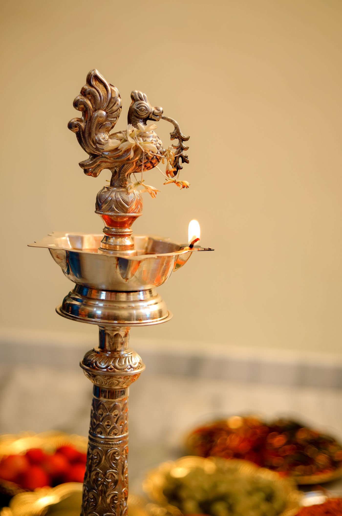 A lit brass oil lamp during temple aarti